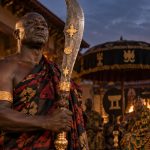 Akan Ahenkwa ceremonial sword with broad curved blade and carved wooden hilt
