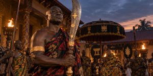 Akan Ahenkwa ceremonial sword with broad curved blade and carved wooden hilt