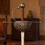 An illustrative reconstruction of a seventeenth-century cup-hilt rapier, showing its protective steel guard, wire-bound grip and long, pointed blade.